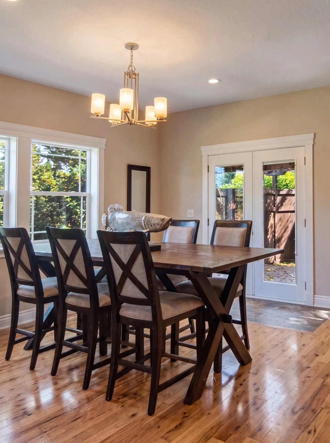 Dining room renovation with hardwood floors by Primier Building & Construction